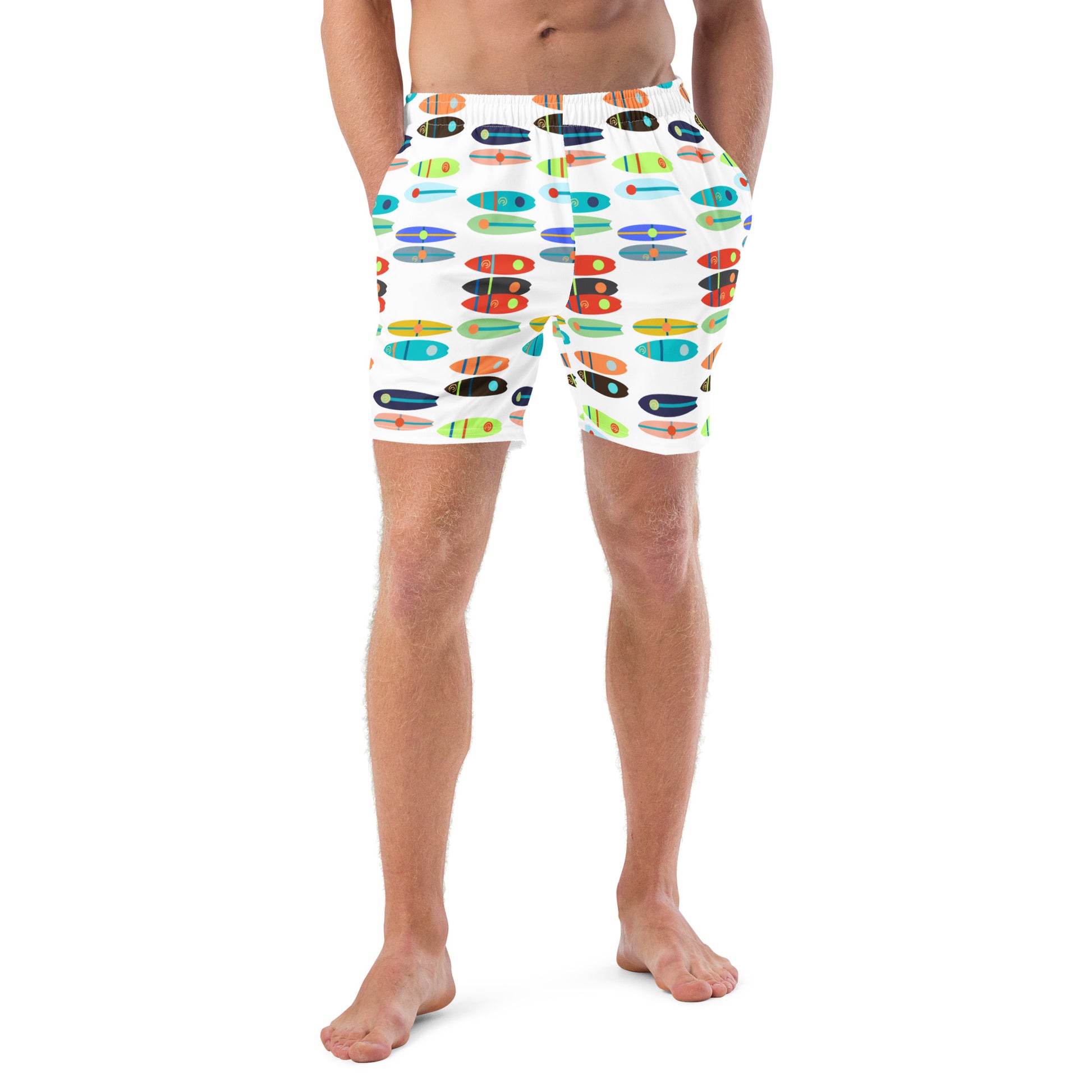 Image of a white swim trunk with a printed pattern of bright color paddle boards.