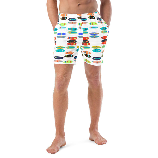 Image of a white swim trunk with a printed pattern of bright color paddle boards.