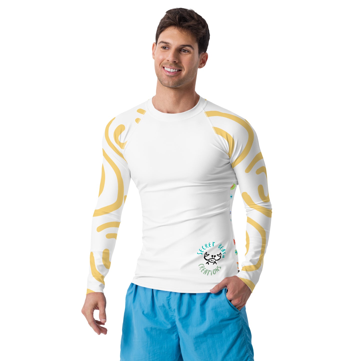 Image of a white long sleeve rash guard with yellow sun lines on the sleeves and a ghost crab outline in the lower right and the words "Secret Beach Creations" in the front and a repeating paddle board pattern in the back.