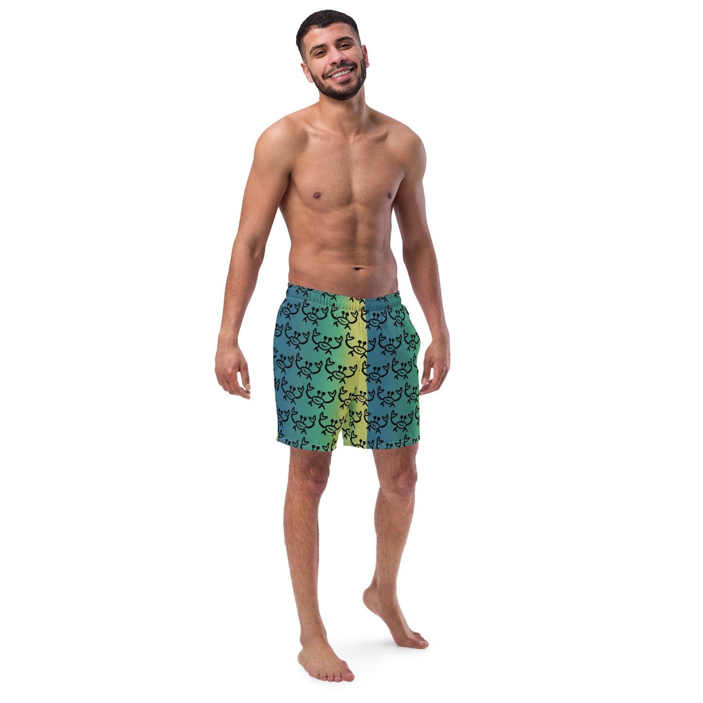 Image of a yellow green swim trunk with a printed pattern of an outline of a happy ghost crab sun outline.