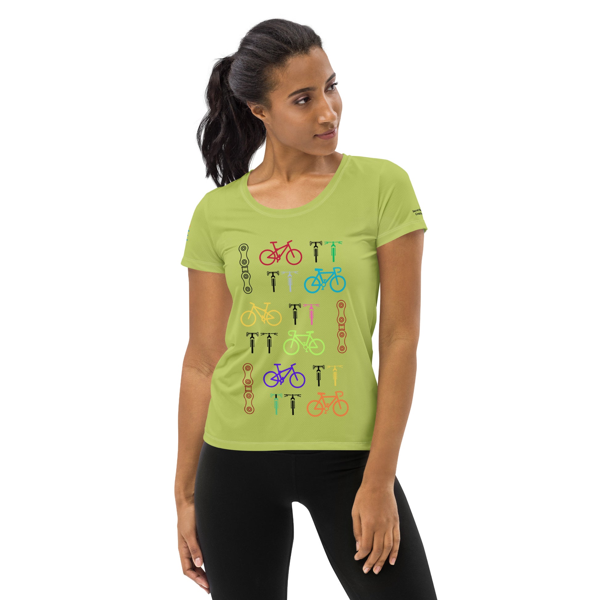 Image of a bright green color athletic t-shirt with bicycle and chain designs.