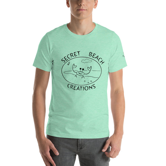 Image of a mint color t-shirt with a ghost crab on a beach with a rocket lifting off in the background outline design with the words "Secret Beach Creations".