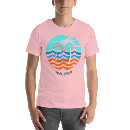 Image of a pink t-shirt with a hammock and palm trees in front of ocean waves design and the words "Hang in there".