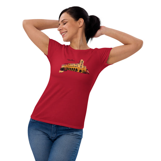 Image of a red t-shirt with an antique 1900 building stylized design and the words "lets go downtown".